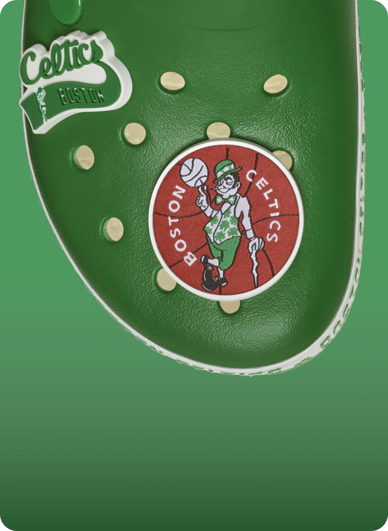 Product feature card highlighting custom personalization with Boston Celtics-themed elevated Jibbitz™ charms included on each pair.