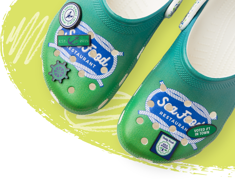 Customized Green Classic Clogs with Custom Seafood logo and Nautical Themed Jibbitz.