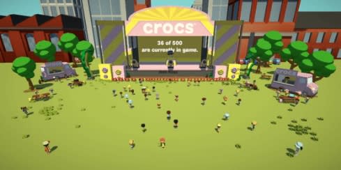 Crocs Festival Stage in front of buildings and amidst trees and festival field. Stage screen reads '36 of 500 are currently in game'. Crocs trucks on either side of stage with digital festival goers milling about.