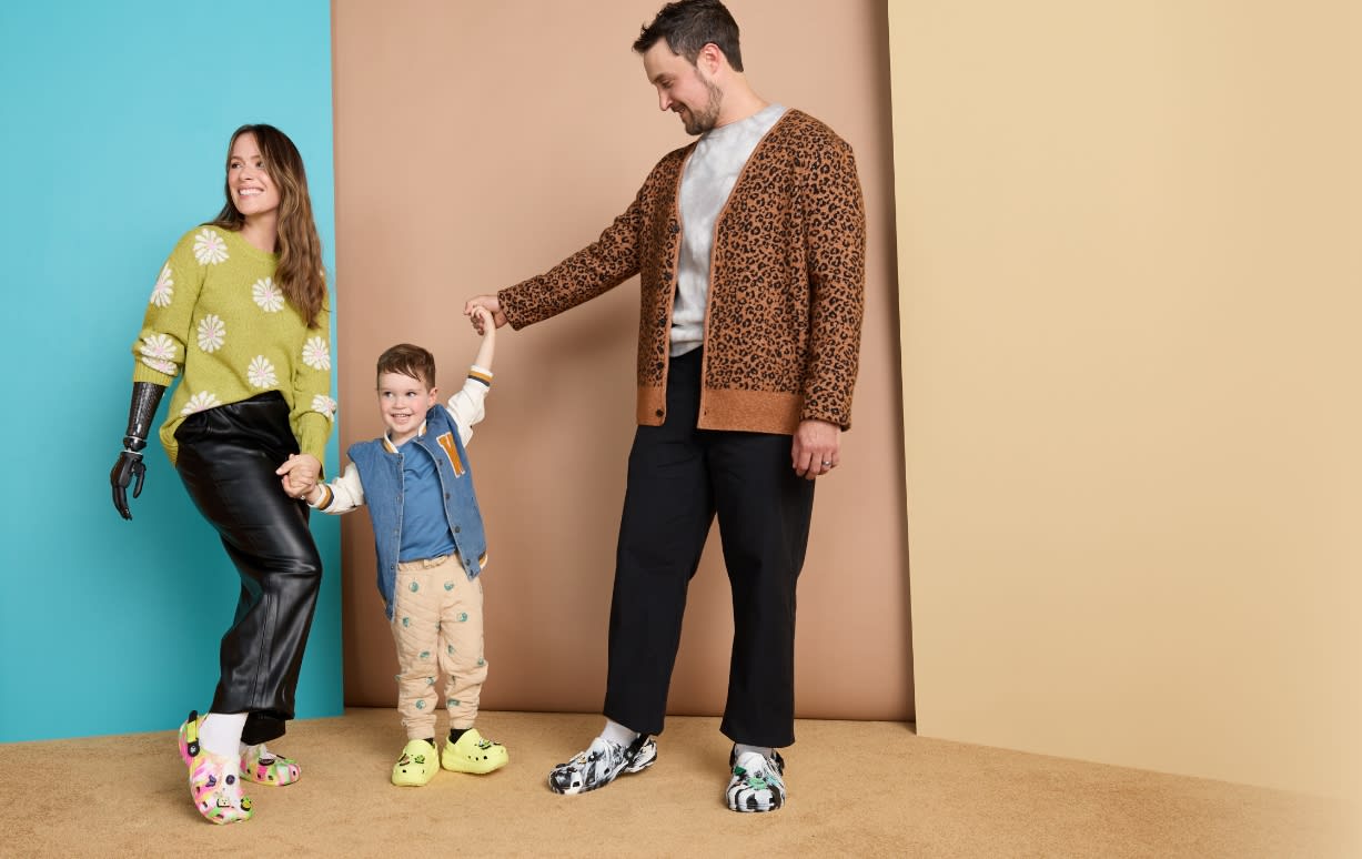 Family posing, wearing Adaptive Clogs.