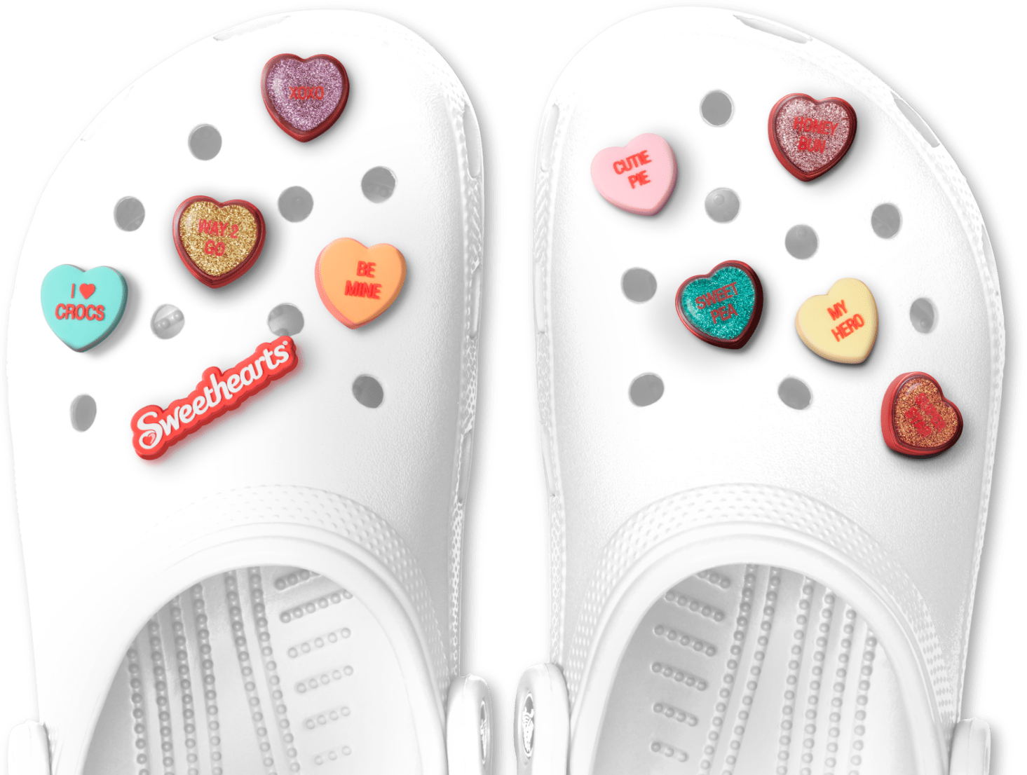 Classic White Clogs with assorted Sweethearts Jibbitz.
