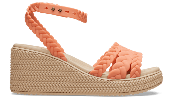 Shop Crocs Brooklyn Woven Ankle Strap Wedge In Grapefruit