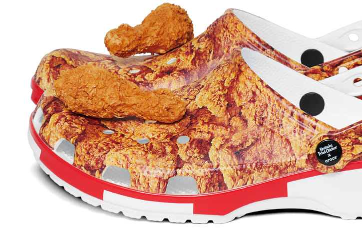Kentucky Fried Chicken® Classic Clogs featuring drumstick Jibbitz™ on top.