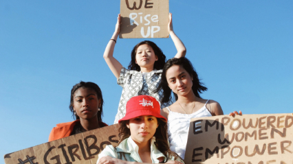 Women holding protest signs.