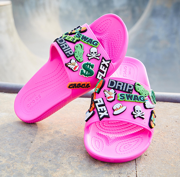 Classic Crocs Slide in Electric Pink.