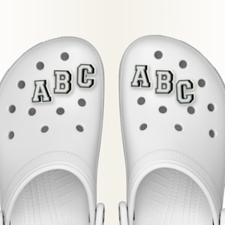 Varsity or collegiate style jibbitz charms, Letters A, B and C displayed on a classic clog.