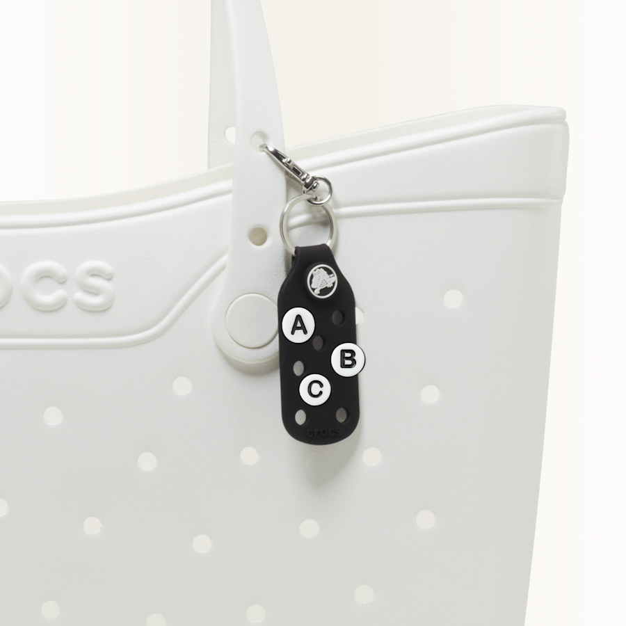 Friendship bead style charms, Letters A, B and C displayed on a keychain.